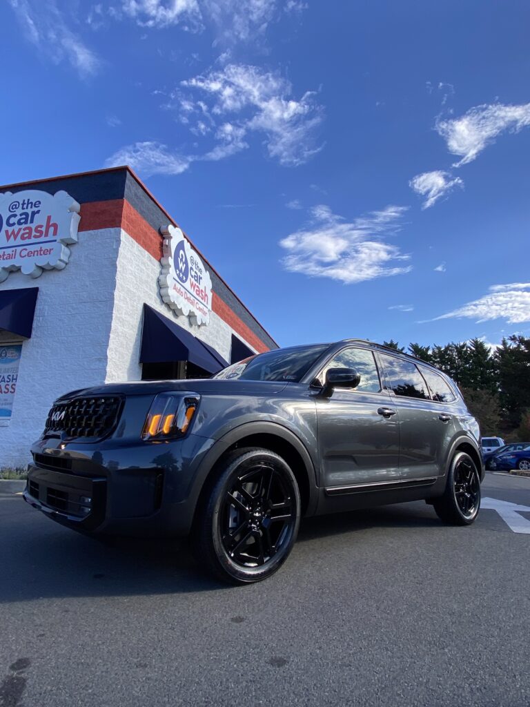 Clean, spot-free SUV parked outside the @ The Car Wash building in Fredericksburg, VA